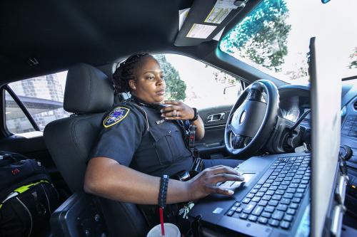 Duke Police officer in squad car